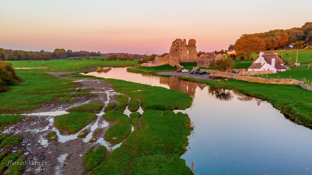 Another sunset of Ogmore castle but this time by drone. The water is still and reflects the setting sun in golden hues