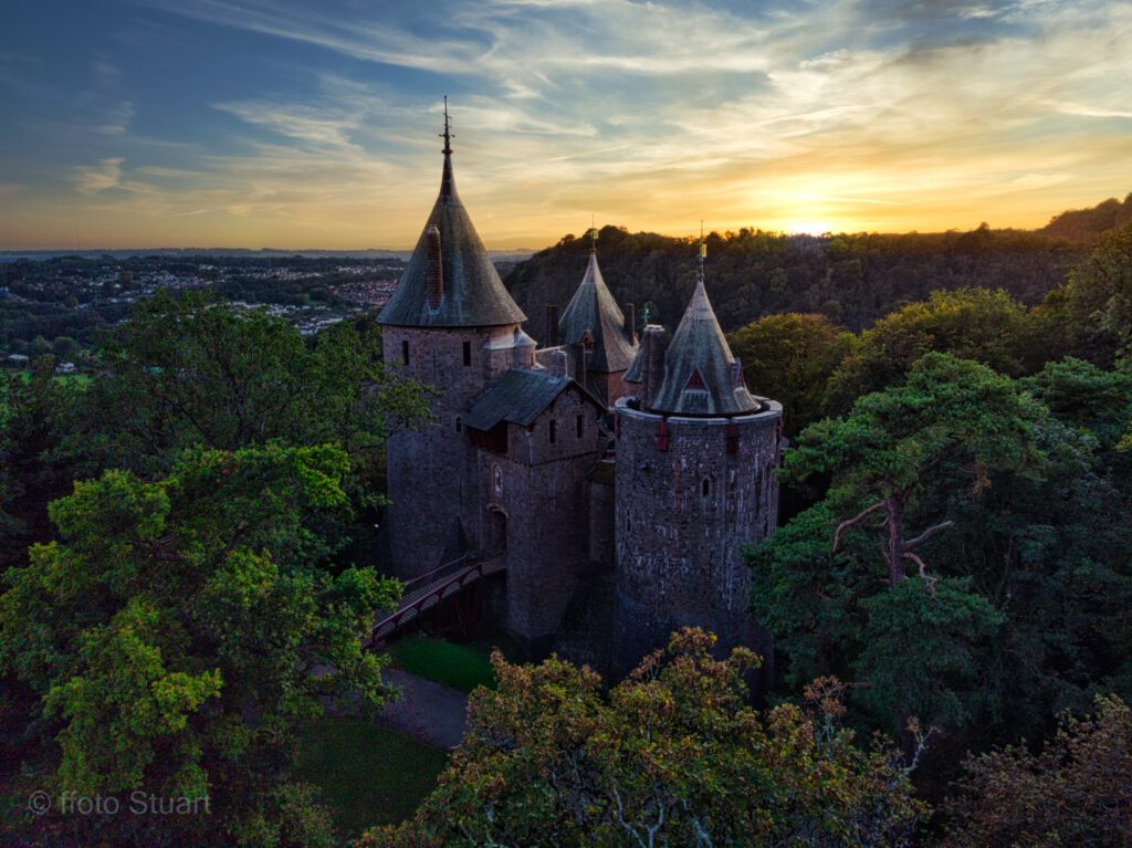 This is one of those fairy tale moments where everything comes together at the same time... a drone shot over the castle as the sun sets across the forest.