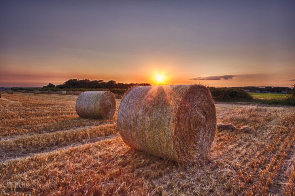Hay Bale Sunset with crepuscular rays